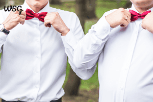 Groomsmen adjusting bow ties, ideal for best man speech inspiration.