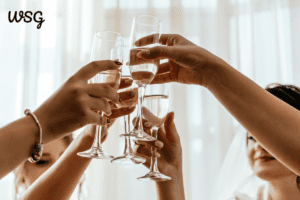 Bridesmaids raising glasses during a wedding toast, symbolizing unity and celebration, perfect for wedding toast examples.