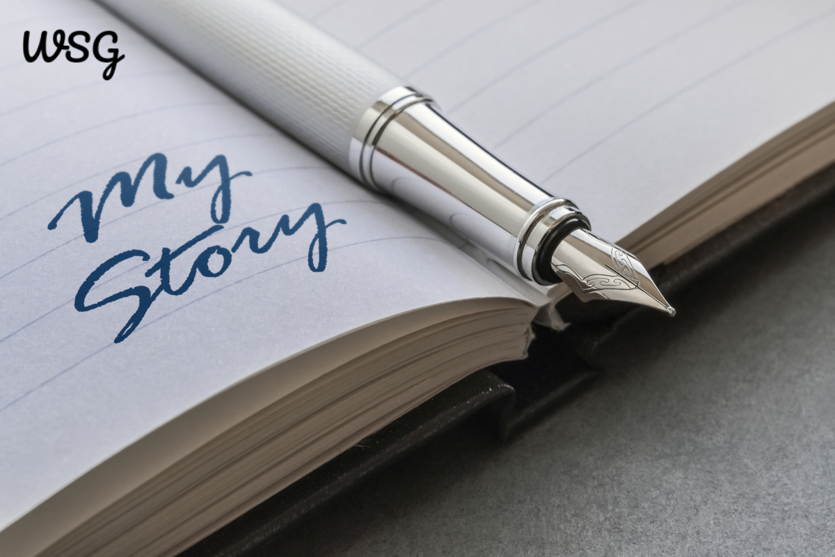 Close-up of a fountain pen on a notebook with the words "My Story" written, symbolizing wedding stories.