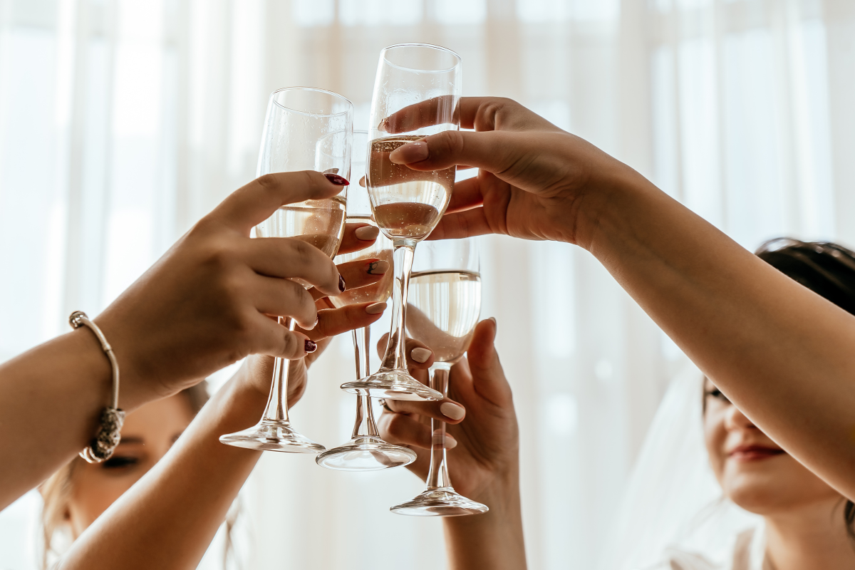 few glasses at a wedding making a toast