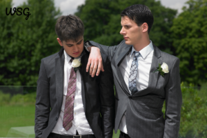 Two brothers sharing a moment before delivering a wedding speech