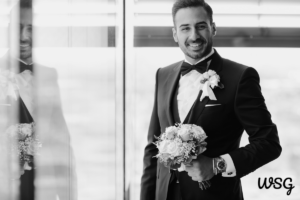 Groom holding bouquet and preparing for his wedding speech