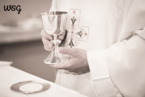 Priest holding a chalice, preparing for a wedding ceremony speech.