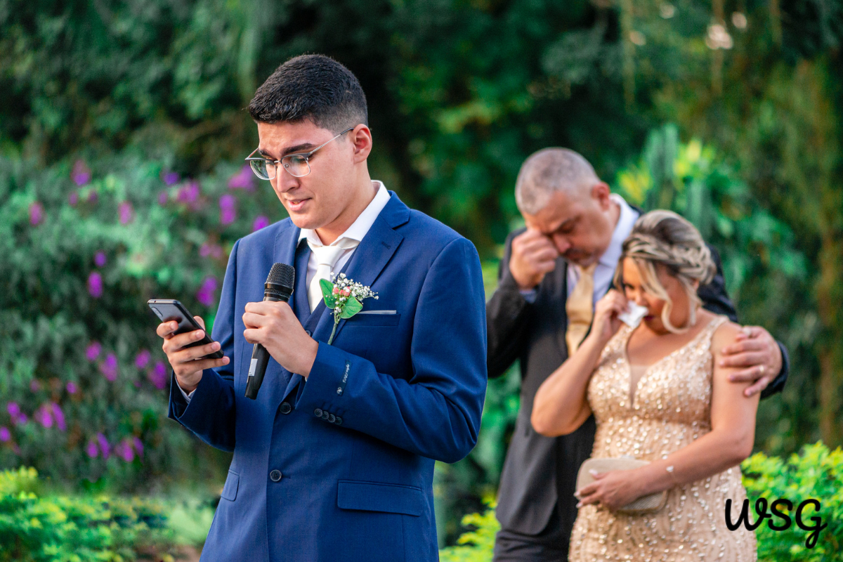 Wedding speech practice with a young man rehearsing his speech in front of family.